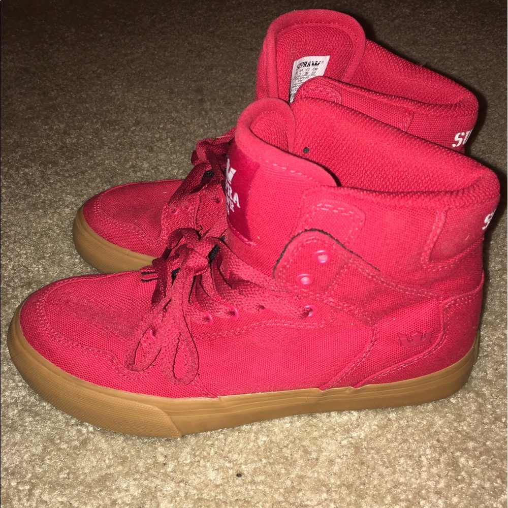 Red high top Supra sneakers